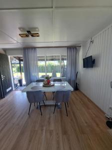 a living room with a table and a couch at Ferienhaus am Edersee-scheid in Waldeck