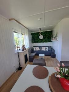 a living room with a couch and a table at Ferienhaus am Edersee-scheid in Waldeck