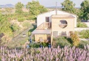 an aerial view of a house with purple flowers at Le Spa des lavandes panoramique in Valensole +16 photos