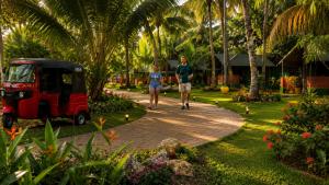 two people walking down a path with a small car at COCO FOREST CAMPING - Luxury Glamping & Villa - ONLY FOR FOREIGN BOOKINGS in Kurunegala +184 photos