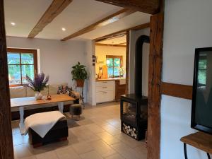 a living room with a fireplace and a stove at Prosinko 25 in Prosinko +43 photos