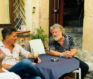 two men sitting at a table with a drink at Kirillos IN CILENTO in Agropoli +78 photos