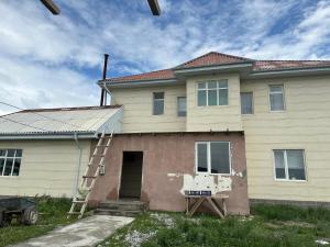 a house with a ladder in front of it at Уметалиев Канат in Birlik