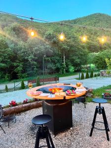 a table with food and drinks on top of it at ACASĂ la Lisa in Lissa