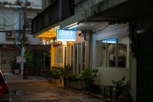 a sign that reads diet house on the side of a building at Diff Hostel in Bangkok +162 photos
