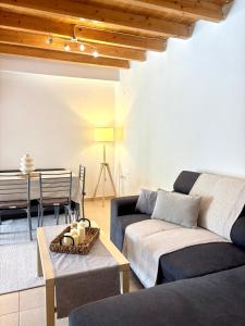 a living room with a couch and a table at Salt & Stone in Drymon
