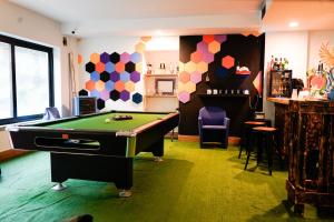 a billiard room with a pool table in it at Valsesia Hostel in Scopello