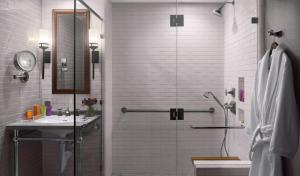 a bathroom with a shower and a sink at Plaza la Reina in Los Angeles +49 photos