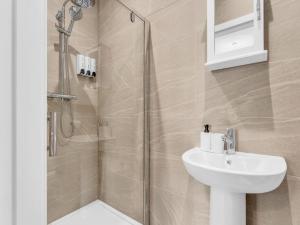 a bathroom with a shower and a sink at LetSavvy Contractor Accommodation Hartlepool in Hartlepool +116 photos