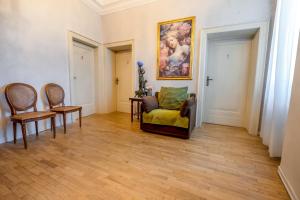 a living room with a couch and two chairs at Hotel Oviv - La dimora del Borgo in Acquaviva Picena +57 photos