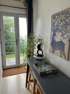 a room with a table with glasses on it at Independent and comfortable room in Arrens-Marsous