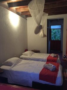 Finca San Rafael - Cafe y Cacao tesisinde bir odada yatak veya yataklar