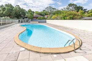 a large swimming pool in a yard with a patio at Villa Lolo, Piscine et Terrasse in Moliets-et-Maa +13 photos