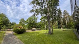 a park with a tree and a gazebo at Best Rest Apartments in Narva-Jõesuu
