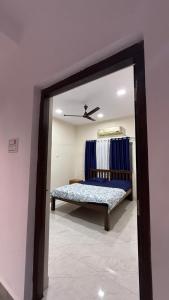 a mirror in a room with a bench in it at Hotel calm resort in Murud