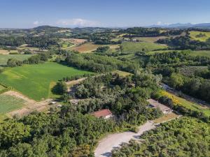 an aerial view of a farm with a river at Vita Da Pacos in Novilara