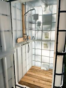 an inside view of a small room with a wooden floor at Lahemaa Nature Glamping - Koit in Vihasoo