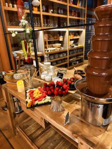 a table with a bunch of food on it at Saman Hotel Boutique in Valencia
