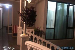 a house with a staircase with a potted plant on it at cosy house in Kobuleti