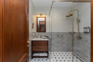 a bathroom with a shower and a sink at Hayasa Hotel Old Yerevan in Yerevan +56 photos