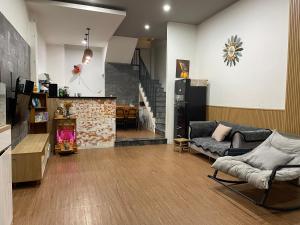 a living room with a couch and a fireplace at Coral Homestay Phan Rang in Kinh Dinh