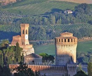 a castle with two towers next to a river at Pretty home near station & Free Parking in Castel Bolognese