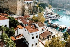 a group of buildings and boats in a harbor at Maxihomes Elissa in Antalya +26 photos