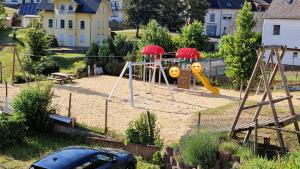 a car parked in a park with a playground at Ferienwohnung Talblick in Horath