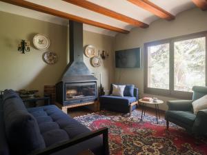 a living room with a couch and a fireplace at Finca Fuente Laurel in Arucas
