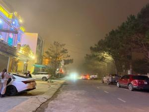 a fire truck is parked on a street at night at Vân Tân Hotel in Kon Von Kla