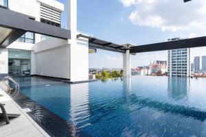 a swimming pool on the roof of a building at Modern and quiet Condo BKK1 - Rooftop Pool in Phnom Penh