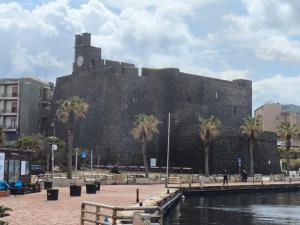 a large brick building with a clock tower on it at Casa Luna in Paceco +32 photos