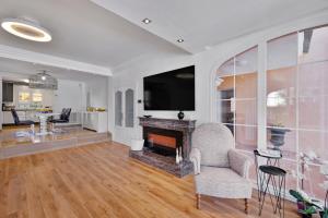 a living room with a fireplace and a tv at Villa Bruno in El Toro