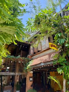 a building with a sign on the side of it at tamarind guesthouse in Phra Nakhon Si Ayutthaya