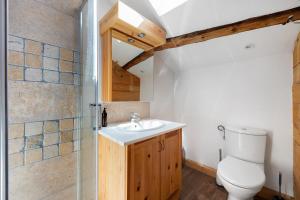 a bathroom with a toilet and a sink at Chalet Le Hameau Tranquille in Courchevel +15 photos
