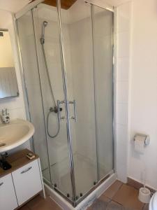 a shower stall in a bathroom with a sink at Casa Helvezia in Cadenazzo