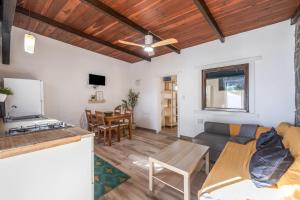 a living room with a couch and a table at Sunwaves 2 - Casa Oasis in El Palmar