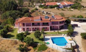 an aerial view of a large house with a swimming pool at Vivenda os Silvas in Lagos +15 photos
