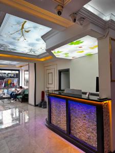 a lobby with a fish tank on the ceiling at Denizli Hotel in Istanbul
