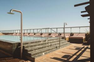 a swimming pool on the roof of a building at Rox Resort in Køge +41 photos