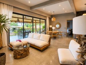 a living room with a couch and a table at SANA Koh Phangan in Salad Beach +99 photos