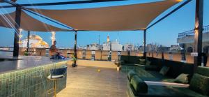 a rooftop bar with a view of the city at Blue Stone H in Madaba