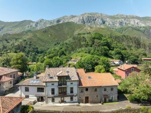 an aerial view of a village with mountains in the background at La Posada del Vencejo in Alles
