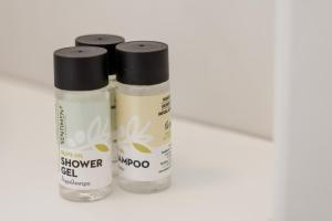 two bottles of shower gel sitting on a table at NEP APT Gennadi in Gennadi