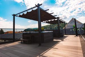 a hot tub on the roof of a building at Hotel Spa & Events Imperial Sighișoara in Sighişoara