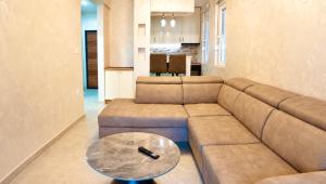 a living room with a couch and a table at Dorado Apartments in Kavač