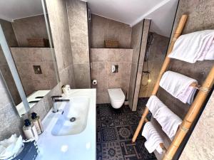 a bathroom with a bunk bed and a sink at L'Escale Côté Sud in LʼÎle-Rousse +89 photos