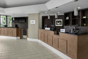 a lobby of a hospital with a reception desk at Four Points by Sheraton Orlando International Drive in Orlando