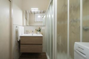 a bathroom with a sink and a shower at Casa Ferdinanda in Monteleone dʼOrvieto +41 photos
