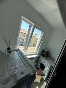 an overhead view of a laundry room with a window at Luxury Apartament in Bacău